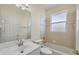 Bathroom featuring a vanity sink and a shower-tub combo with tiled wall at 109 Westwind Dr, Placida, FL 33946