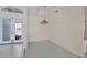Well lit dining area with tiled floors and a decorative chandelier at 109 Westwind Dr, Placida, FL 33946