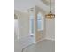 Elegant foyer with a decorative chandelier and a view of the formal dining room at 109 Westwind Dr, Placida, FL 33946