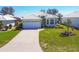 Charming single-story home with a well-maintained lawn and a two-car garage at 109 Westwind Dr, Placida, FL 33946