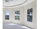 Bright living room with large windows offering scenic views and plenty of natural light at 109 Westwind Dr, Placida, FL 33946