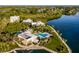 Aerial view of a pool, waterfront access, and landscaping at 11000 Placida Rd # 301, Placida, FL 33946