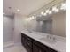 Bathroom features double sinks, stylish lighting, and a glass-enclosed shower at 11000 Placida Rd # 301, Placida, FL 33946