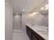 Bathroom features double sinks, stylish lighting, and a glass-enclosed shower at 11000 Placida Rd # 301, Placida, FL 33946