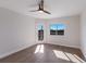 Bright bedroom features hardwood floors, ceiling fan, and lots of natural light at 11000 Placida Rd # 301, Placida, FL 33946
