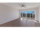 Bright bedroom with hardwood floors and sliding glass doors to a balcony at 11000 Placida Rd # 301, Placida, FL 33946