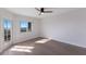 Bright bedroom features hardwood floors, ceiling fan and views of the river at 11000 Placida Rd # 301, Placida, FL 33946