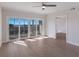 Bright bedroom with hardwood floors and sliding glass doors to a balcony at 11000 Placida Rd # 301, Placida, FL 33946