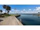 Scenic waterfront dock with an American flag waving in the breeze and calm, inviting waters at 11000 Placida Rd # 301, Placida, FL 33946