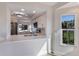 Modern white kitchen with stainless steel appliances and a large island at 11000 Placida Rd # 301, Placida, FL 33946