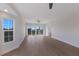 Bright living room with hardwood floors, ceiling fan, and sliding glass doors to a balcony at 11000 Placida Rd # 301, Placida, FL 33946