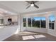 Bright living room with hardwood floors, ceiling fan, and view to kitchen at 11000 Placida Rd # 301, Placida, FL 33946