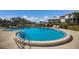 Community outdoor pool with a clear blue water and ladder access for easy entry at 11000 Placida Rd # 301, Placida, FL 33946