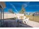 Backyard featuring a paver patio and firepit with white chairs at 13532 Romford Ave, Port Charlotte, FL 33981