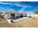 Backyard patio is perfect for outdoor relaxation and entertaining with an outdoor table at 13532 Romford Ave, Port Charlotte, FL 33981