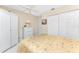 Bedroom featuring neutral tones, large closets, and a ceiling fan at 13532 Romford Ave, Port Charlotte, FL 33981