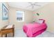 A cozy bedroom with a bright, inviting atmosphere and natural light at 13532 Romford Ave, Port Charlotte, FL 33981