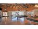Clubhouse interior featuring stone accents, pool table, ping pong table, and natural lighting at 13532 Romford Ave, Port Charlotte, FL 33981