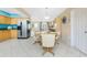 Bright dining area connected to kitchen and living room offers a practical and comfortable space at 13532 Romford Ave, Port Charlotte, FL 33981