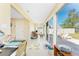Bright Florida room with tile floors and a view of the outdoor living space at 13532 Romford Ave, Port Charlotte, FL 33981
