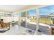Inviting Florida room featuring tile flooring and views of the outdoor patio at 13532 Romford Ave, Port Charlotte, FL 33981
