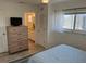 Bedroom with a closet and an ensuite bathroom that has tiled floors at 1449 Deer Creek Dr, Englewood, FL 34223