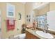 Cozy bathroom with beach theme décor, granite countertop and shower/bath combination at 252 Australian Dr, Rotonda West, FL 33947