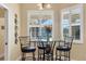 Charming breakfast nook with plantation shutters allows natural light into the quaint eating space at 252 Australian Dr, Rotonda West, FL 33947