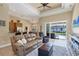 Open-concept living room with sliding glass doors to pool, seamlessly blending indoor and outdoor living spaces at 252 Australian Dr, Rotonda West, FL 33947