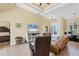 Comfortable living area with tile flooring, neutral tones, and views into the dining area offering comfortable relaxation at 252 Australian Dr, Rotonda West, FL 33947