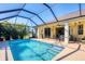 Sparkling screened-in pool with a spacious patio, perfect for outdoor entertaining. Features a well-maintained backyard and landscaping at 252 Australian Dr, Rotonda West, FL 33947