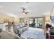 Living room with neutral walls and furniture, and a great view of the pool area at 39 Tournament Rd, Rotonda West, FL 33947