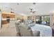 Open-concept living area that flows out to the pool via sliding glass doors at 39 Tournament Rd, Rotonda West, FL 33947