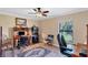 Office area with dark wood desk, rolling chairs, carpet and a view of the outdoors at 39 Tournament Rd, Rotonda West, FL 33947