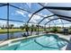 Screened pool overlooking canal, perfect for relaxing and entertaining with water views at 39 Tournament Rd, Rotonda West, FL 33947