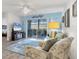 Cozy living room featuring sliding glass doors to the lanai at 5725 Greenwood Ave # 8101, North Port, FL 34287