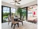 Bright dining area features sliding doors leading to the screened lanai and pool area at 9533 Arnaz Cir, Port Charlotte, FL 33981