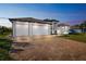 Stunning new home features a brick paver driveway, lush landscaping, and a three-car garage at 9533 Arnaz Cir, Port Charlotte, FL 33981