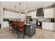 Well-appointed kitchen with a center island, granite countertops, and stainless steel appliances at 9533 Arnaz Cir, Port Charlotte, FL 33981