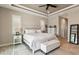 Serene bedroom features a tray ceiling, neutral color palette, and ample natural light at 9533 Arnaz Cir, Port Charlotte, FL 33981