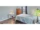 Comfortable bedroom featuring a calm color scheme, window, and a neutral-colored bedspread at 10307 Grail Ave, Englewood, FL 34224