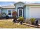Inviting entrance with decorative door and well-maintained landscaping creates a welcoming curb appeal at 10307 Grail Ave, Englewood, FL 34224