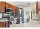 Well-equipped kitchen features stainless steel appliances and ample counter space for meal preparation at 10307 Grail Ave, Englewood, FL 34224