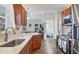 Bright kitchen featuring light countertops, stainless steel appliances and breakfast bar at 10307 Grail Ave, Englewood, FL 34224