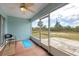 Bright lanai with tile floor and large windows provides natural light at 10307 Grail Ave, Englewood, FL 34224