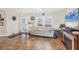 Spacious living room featuring tile flooring, a fireplace and access to the outdoors at 10307 Grail Ave, Englewood, FL 34224