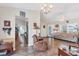 Open-concept living area with tile flooring, seamlessly connecting the living room and kitchen at 10307 Grail Ave, Englewood, FL 34224