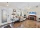 Comfortable living room with tile flooring, a fireplace, and abundant natural light at 10307 Grail Ave, Englewood, FL 34224