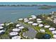Aerial view of waterfront community with boat docks, lush landscaping, and bay access at 11000 Placida Rd # 101, Placida, FL 33946