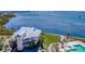 Waterfront home with balconies, lush lawn, and access to a community pool at 11000 Placida Rd # 101, Placida, FL 33946
